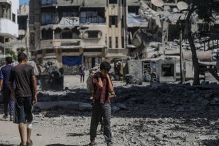 Le plan a été accueilli avec scepticisme dans la bande de Gaza, ravagée par deux ans de guerre. Le Hamas doit se prononcer. KEYSTONE/EPA/MOHAMMED SABER